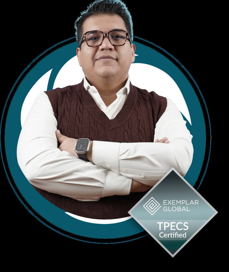 Professional headshot of a man wearing glasses, brown vest, and white shirt with arms crossed, displaying TPECS Certified badge